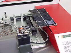 Royce DE35-ST output station configured with underside inspection and die inverter